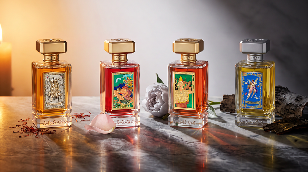 Four Argos Fragrances bottles representing four fragrance personalities arranged on dark marble with dramatic studio lighting