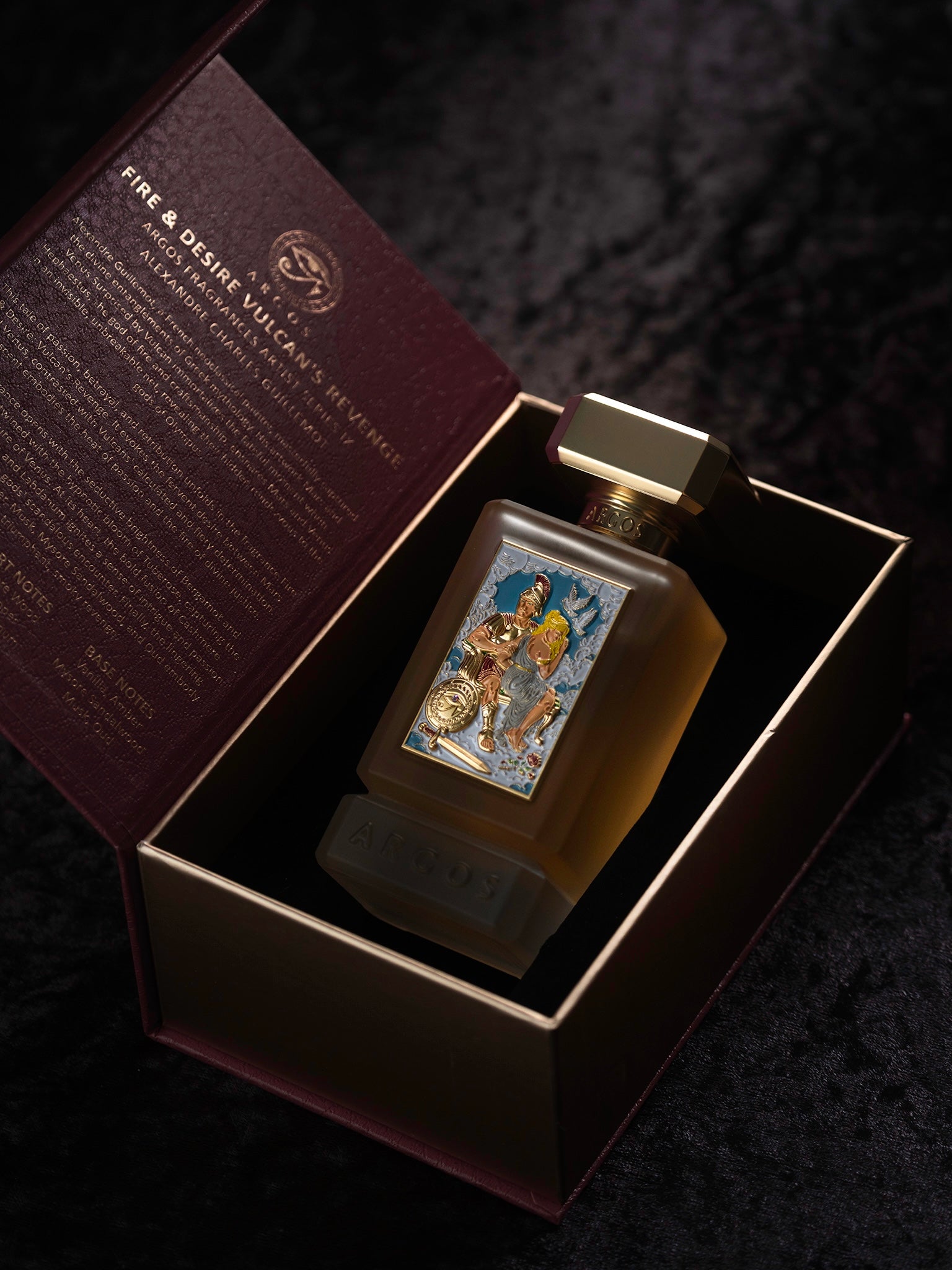 Argos Fire & Desire Vulcan's Revenge Perfume bottle with decorative label in an open box on a dark background