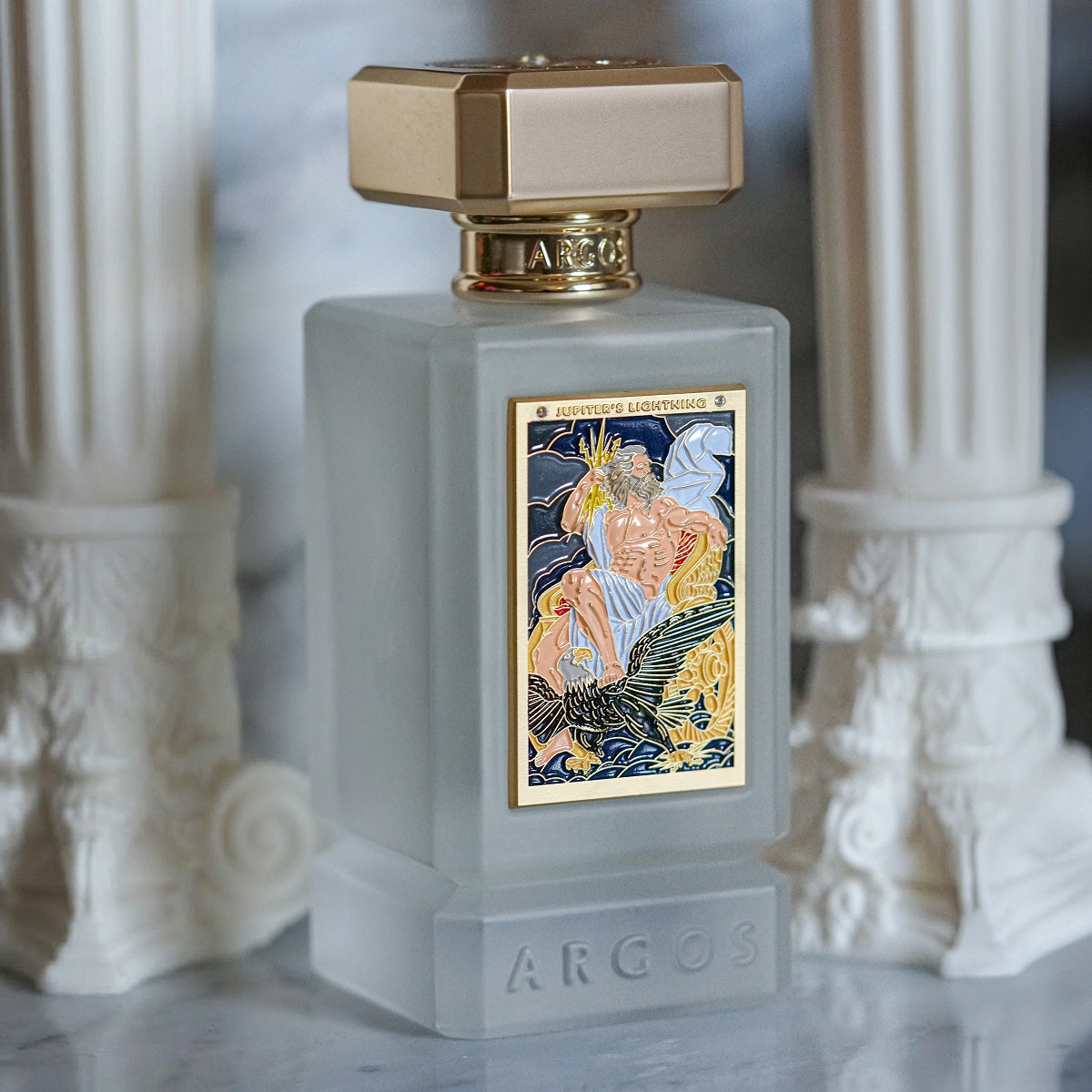 Jupiter's Lightning Perfume bottle with decorative label on a marble surface