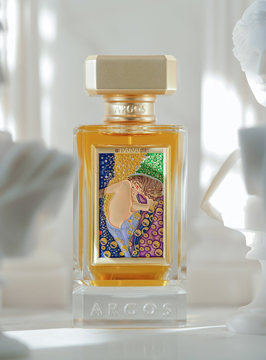 Argos Fragrances New Release DANAE 100ml Bottle Front View Surrounded with Artistics Sculptures