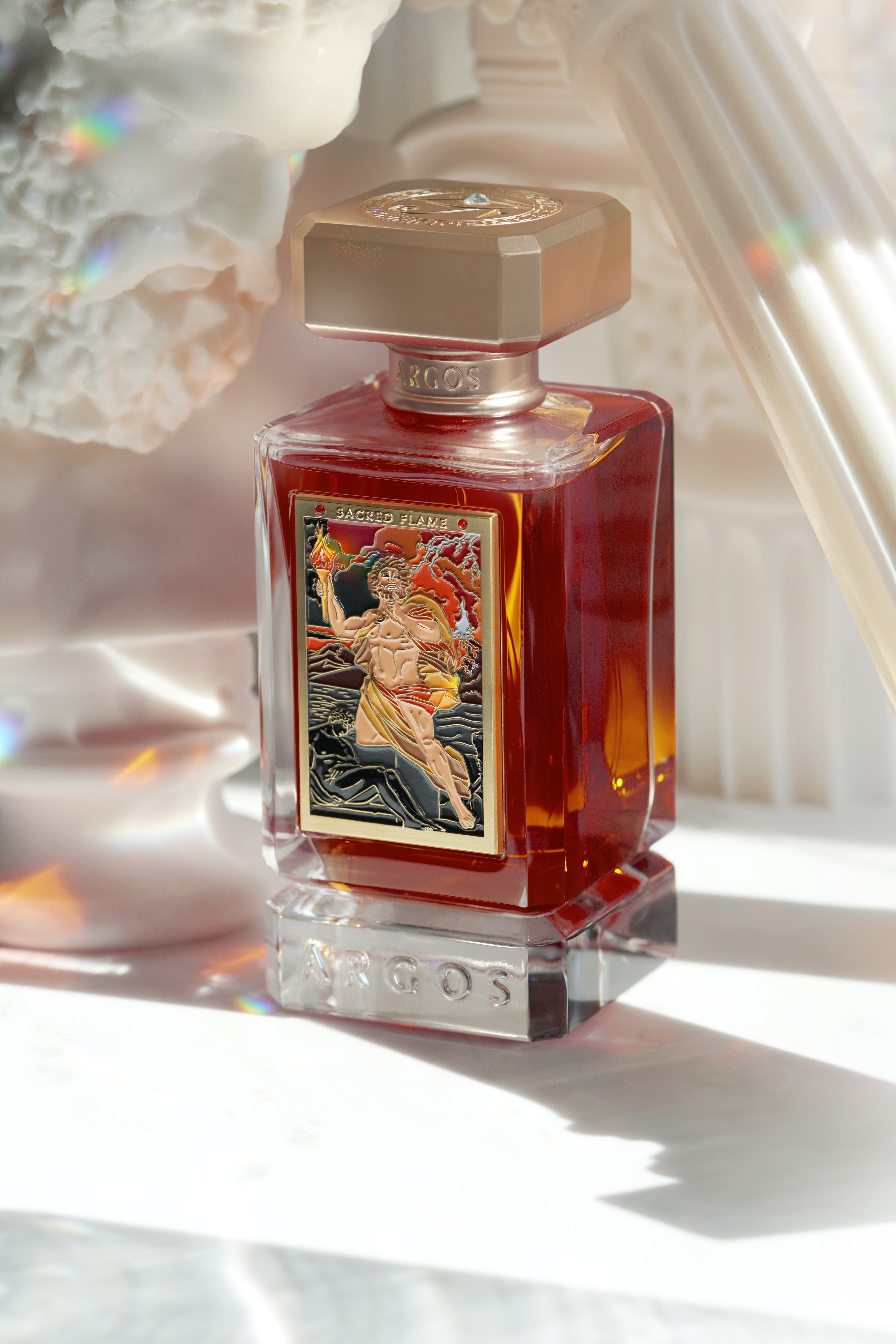 Front view of the Argos Sacred Flame perfume bottle with color-corrected tones.

