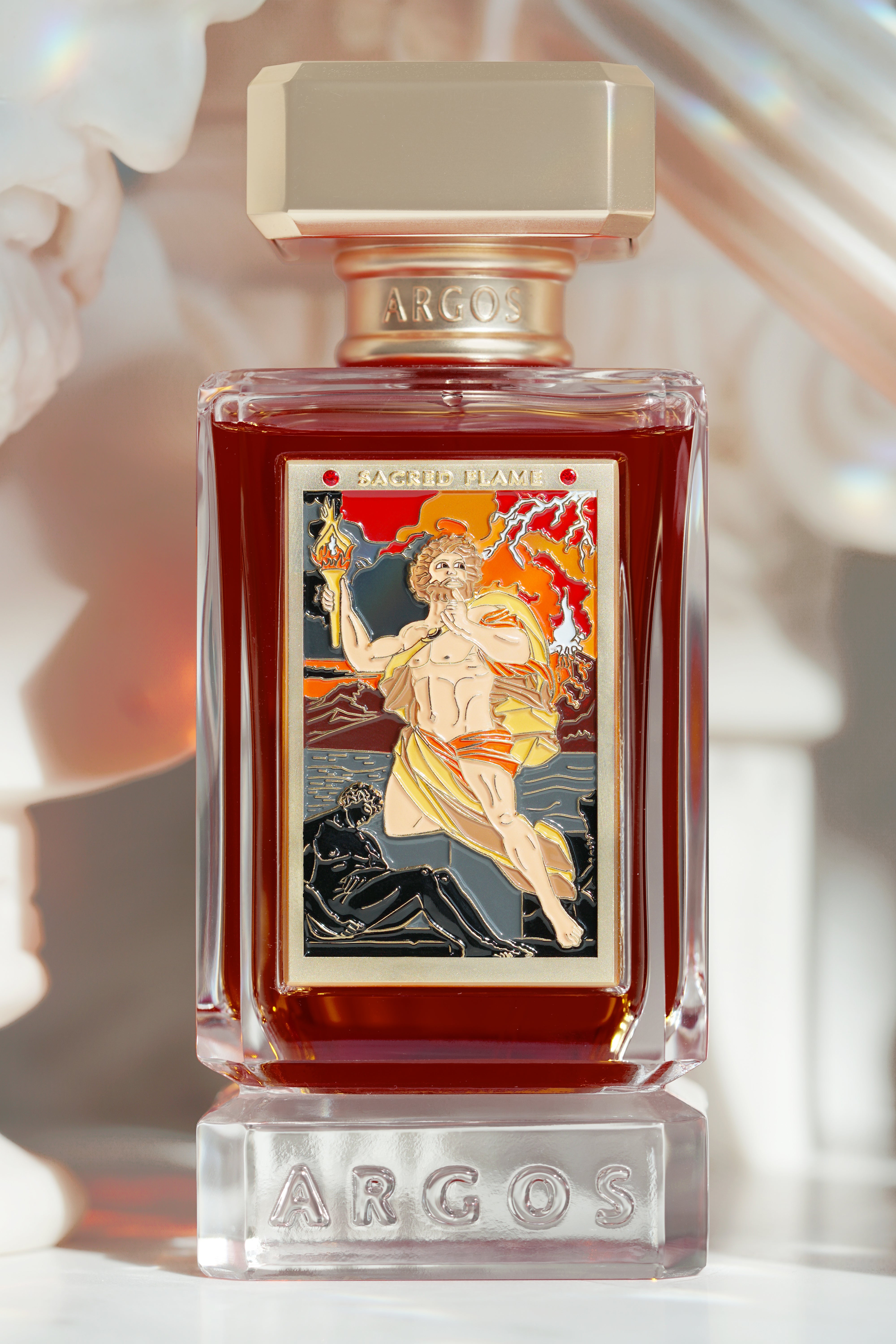 Side-angle shot of the Sacred Flame bottle highlighting the intricate golden detailing.


