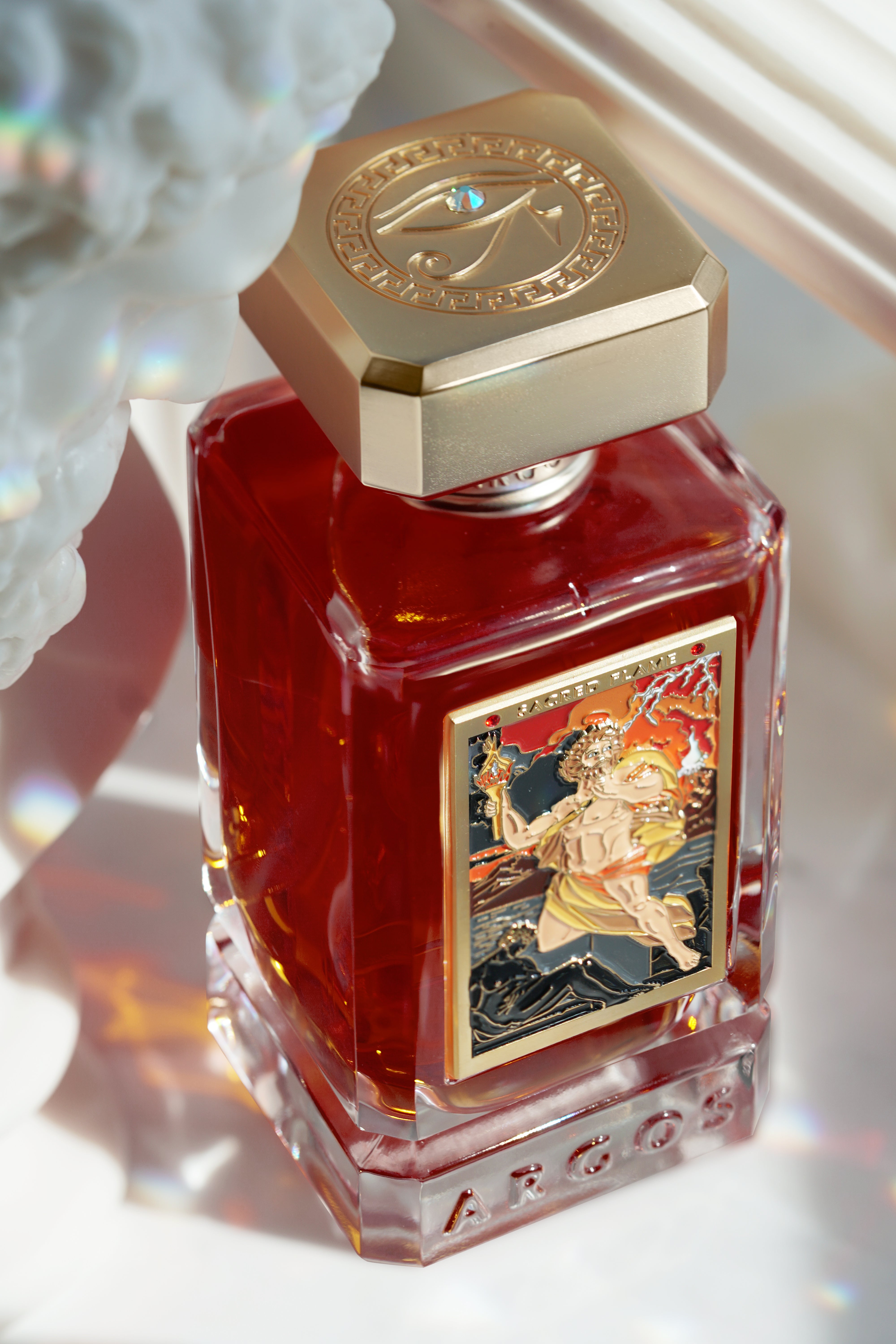 Close-up of the Sacred Flame label on the Argos perfume bottle with clear engraving.