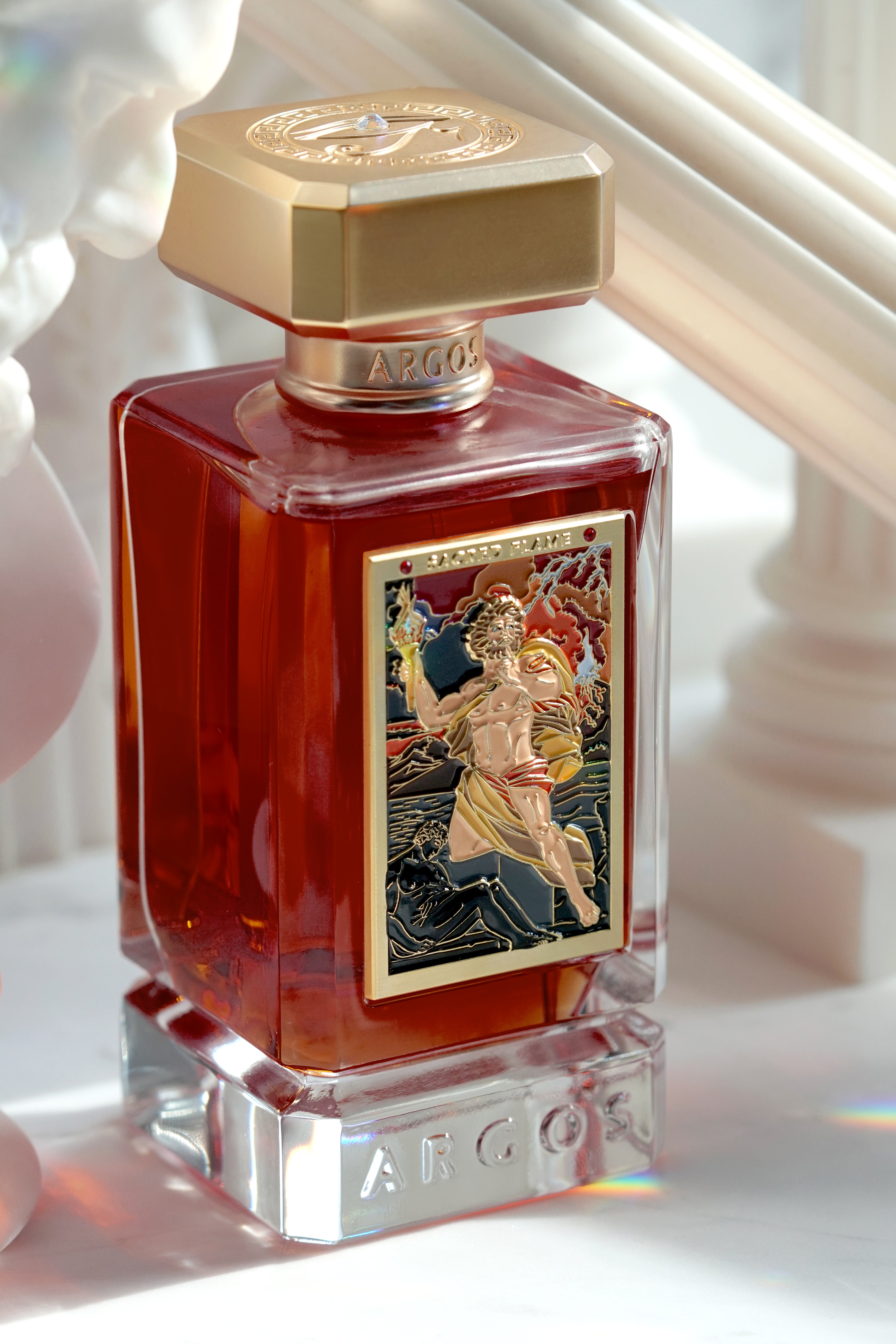 Argos Sacred Flame bottle held in hand, showcasing its size and elegance.