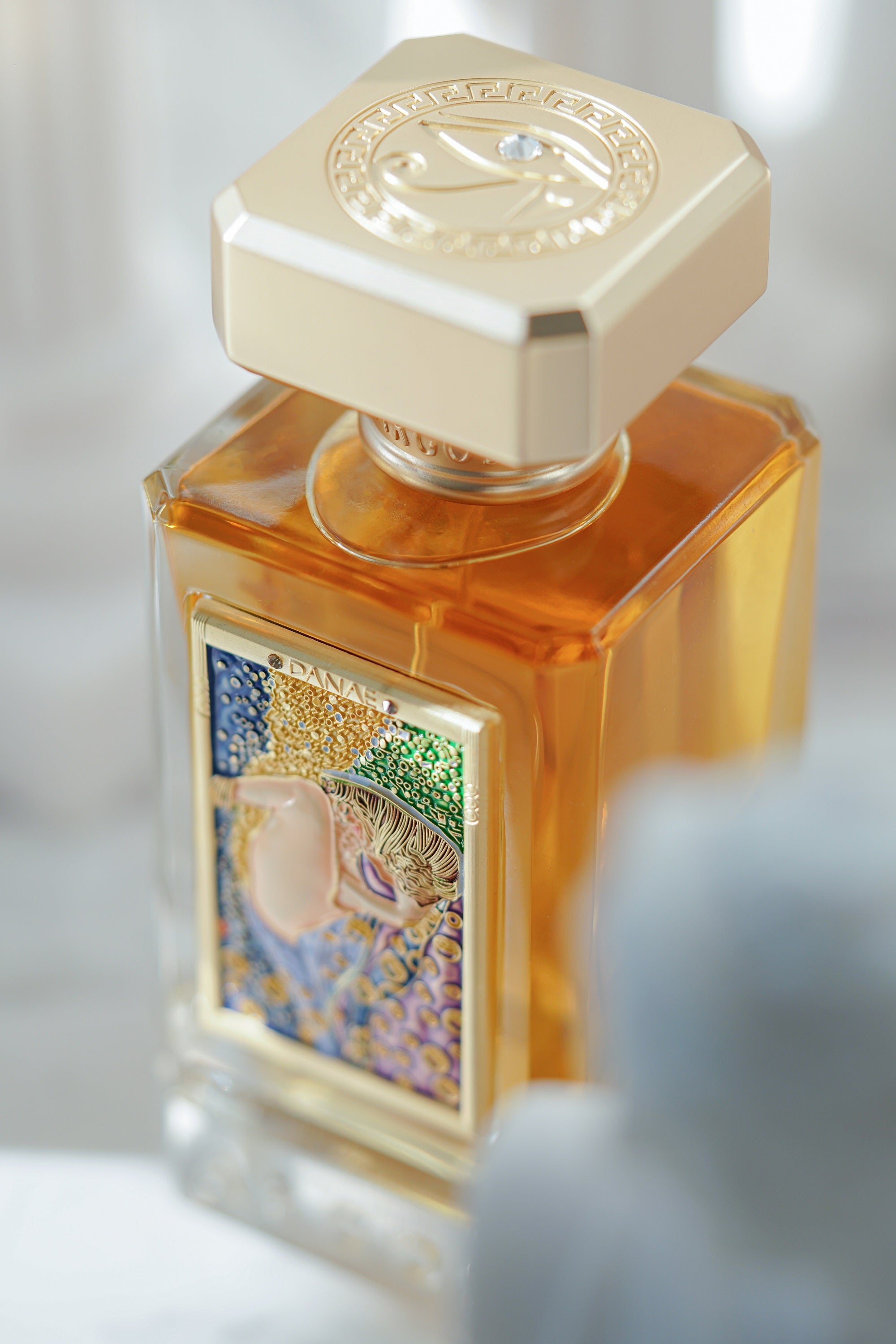 New Argos DANAE Perfume 100ml Bottle Captured Naturally and Surrounded with Sculptures
